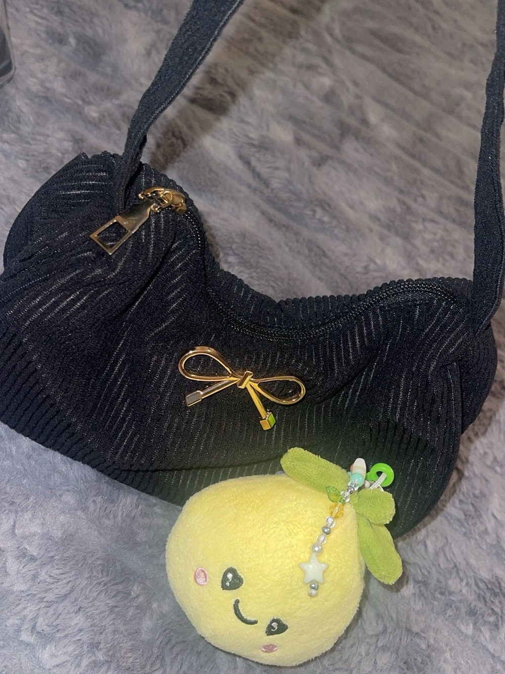 Chic Black Shoulder Bag with Gold Bow Accent